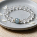 Natural white crystal paired with aquamarine elastic beaded bracelet